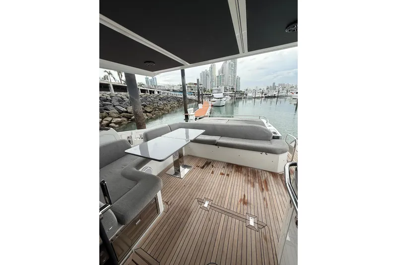  Yacht Photos Pics 2019 Azimut S6 yacht deck with seating, table, and marina view.