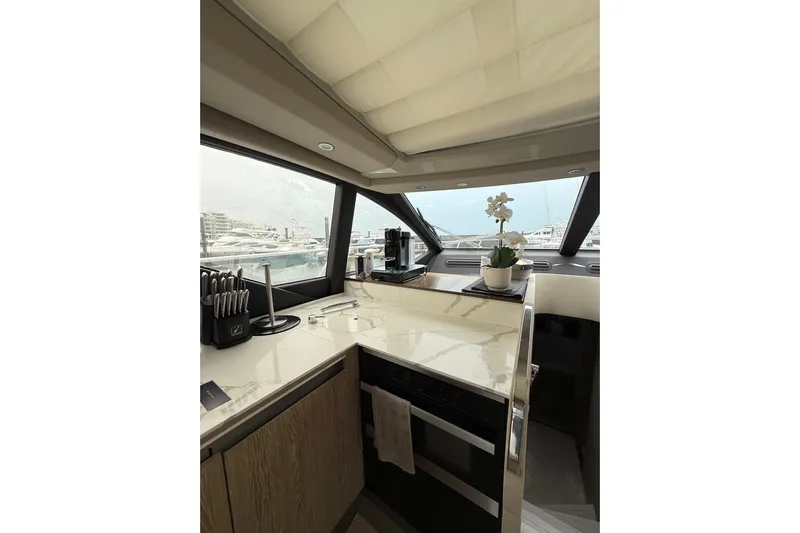  Yacht Photos Pics Interior of 2019 Azimut S6 yacht with modern kitchen and marina view.
