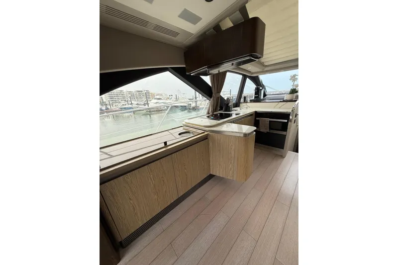 Yacht Photos Pics Luxurious interior of 2019 Azimut S6 yacht with modern kitchen and marina view.
