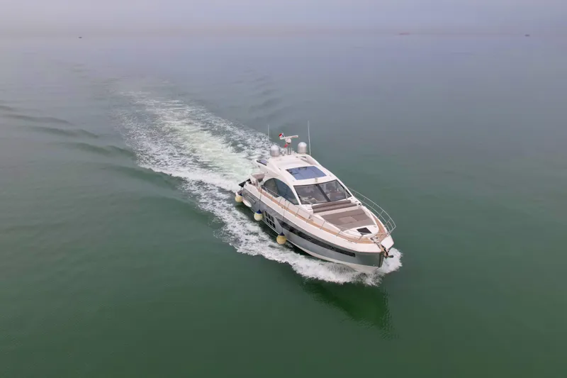  Yacht Photos Pics 2019 Azimut S6 yacht cruising on calm waters, leaving a gentle wake.