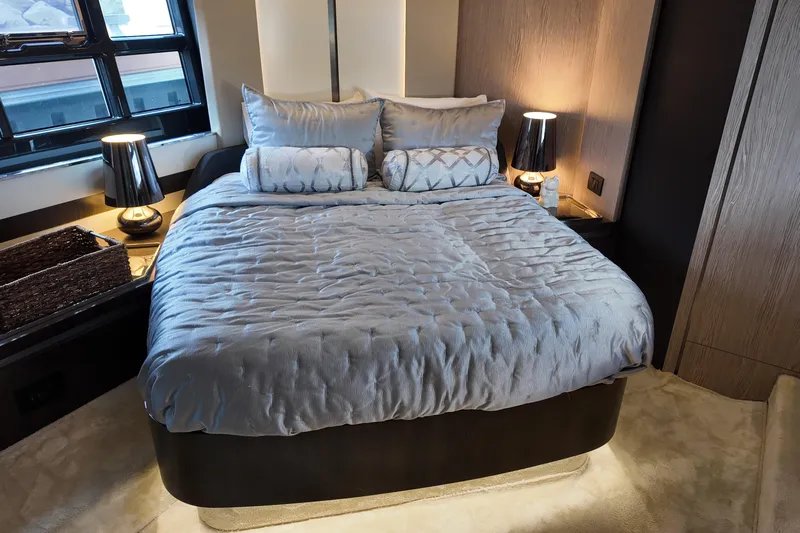  Yacht Photos Pics Luxurious bedroom interior on 2019 Azimut S6 yacht with elegant bedding and ambient lighting.
