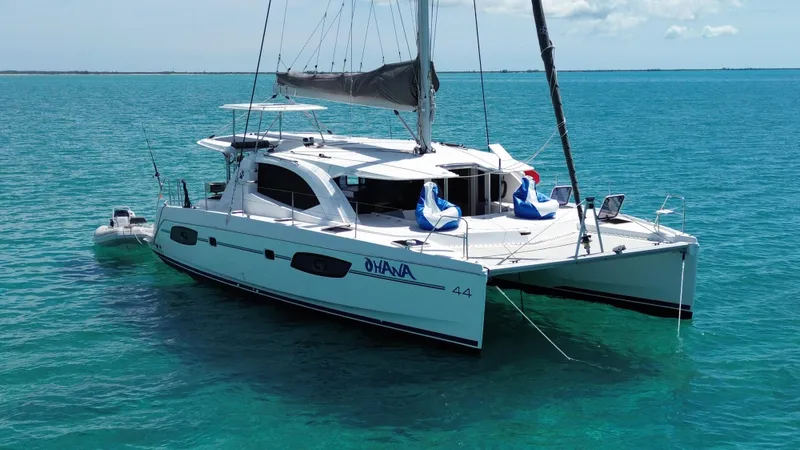  Yacht Photos Pics 2016 Leopard 44 catamaran sailing on clear turquoise waters.