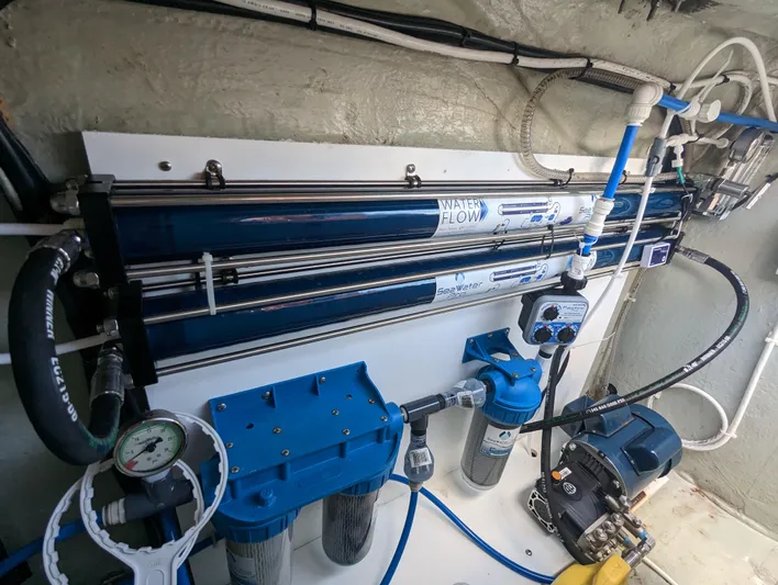  Yacht Photos Pics Water filtration system in a 2016 Leopard 44 yacht, featuring multiple filters and gauges.