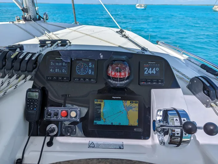  Yacht Photos Pics Helm of 2016 Leopard 44 catamaran with navigation instruments and ocean view.