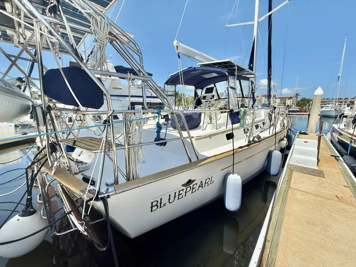 Bluepearl Yacht Photos Pics Sailboat "Blue Pearl" docked, 2006 Passport Vista 515CC, sunny marina setting.