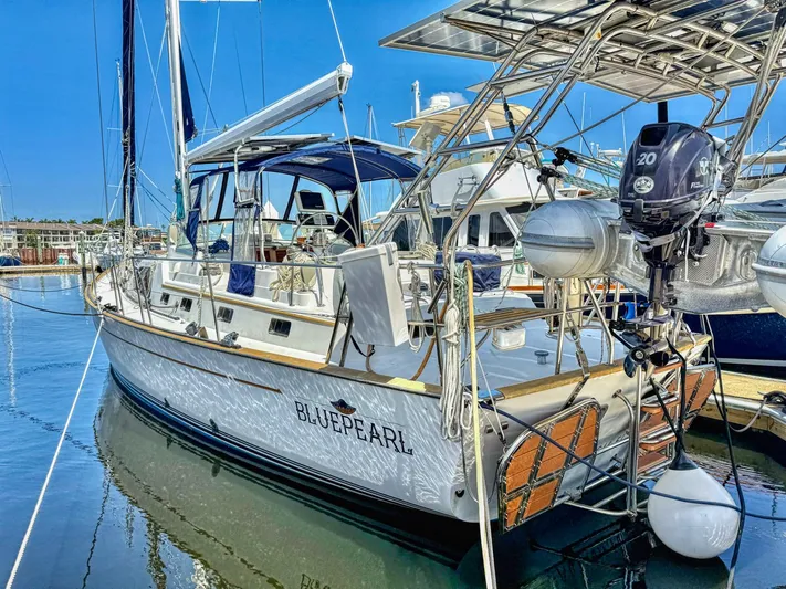 Bluepearl Yacht Photos Pics Sailboat "Blue Pearl" docked, 2006 Passport Vista 515CC, sunny marina setting.