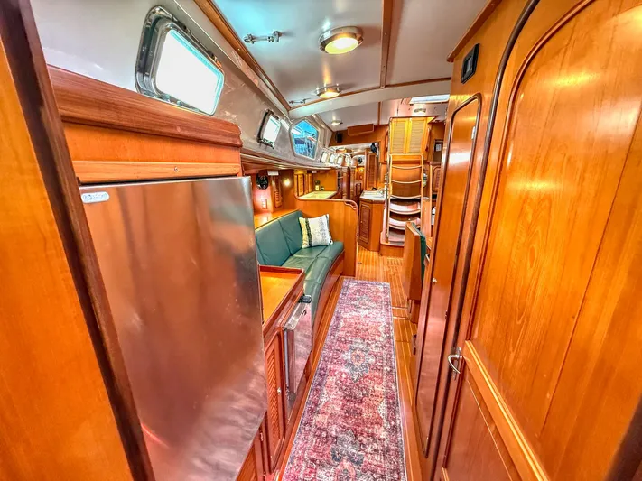 Bluepearl Yacht Photos Pics Luxurious interior of 2006 Passport Vista 515CC yacht with wood finishes and modern amenities.