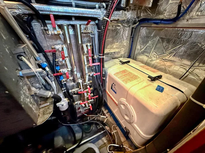 Bluepearl Yacht Photos Pics Engine room of 2006 Passport Vista 515CC with complex piping and equipment.