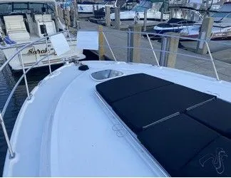 Slipknot Yacht Photos Pics 2012 Sea Ray 410 Sundancer yacht docked at marina, featuring spacious deck and sleek design.