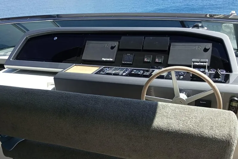  Yacht Photos Pics Helm of 2019 Sanlorenzo 86 yacht with modern navigation equipment and steering wheel.