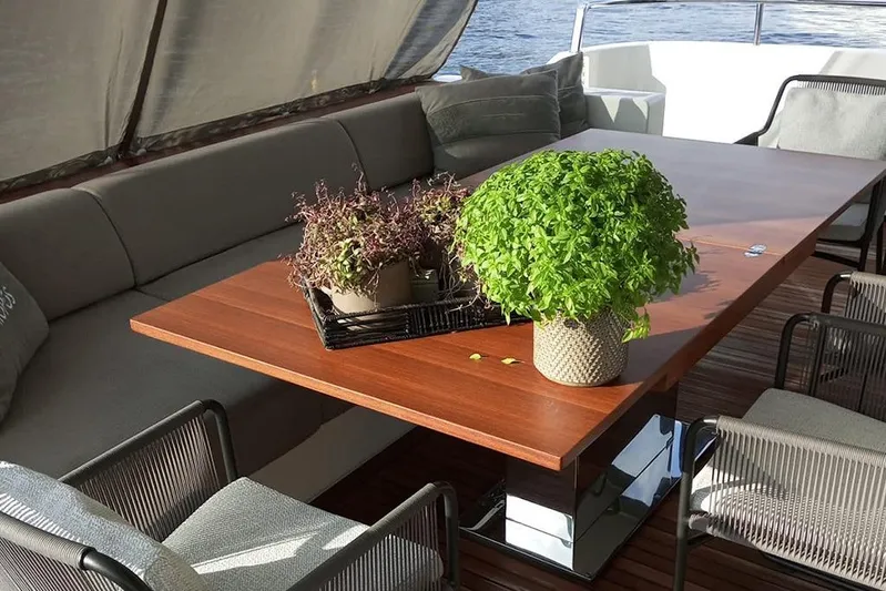  Yacht Photos Pics Luxurious Sanlorenzo 86 yacht deck with elegant seating and potted plants, 2019 model.