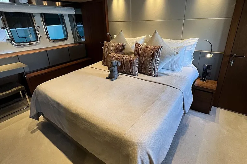  Yacht Photos Pics Luxurious bedroom interior on a 2019 Sanlorenzo 86 yacht, featuring elegant bedding and decor.