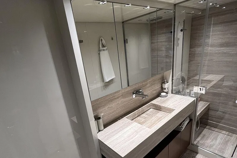  Yacht Photos Pics Luxurious bathroom in 2019 Sanlorenzo 86 yacht with modern fixtures and elegant design.