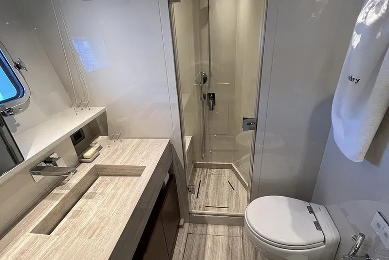  Yacht Photos Pics Luxurious bathroom in 2019 Sanlorenzo 86 yacht with modern fixtures and elegant design.