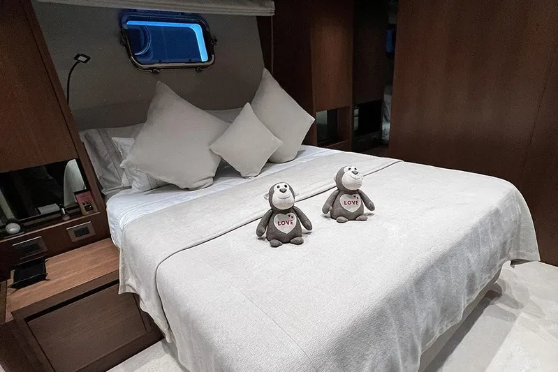  Yacht Photos Pics Luxurious Sanlorenzo 86 yacht bedroom with plush bedding and decorative pillows, 2019 model.