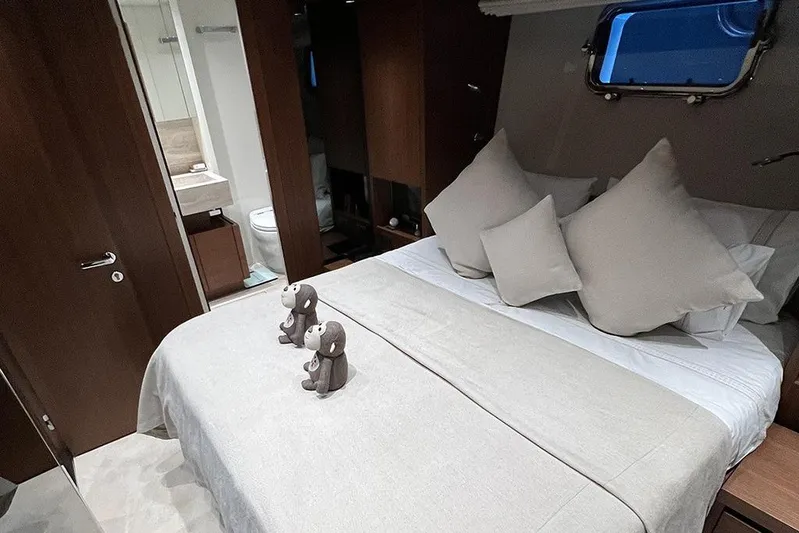  Yacht Photos Pics Luxurious bedroom interior of 2019 Sanlorenzo 86 yacht with plush bedding and decor.