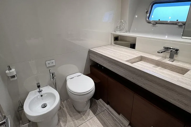  Yacht Photos Pics Luxurious bathroom in 2019 Sanlorenzo 86 yacht with modern fixtures and elegant design.