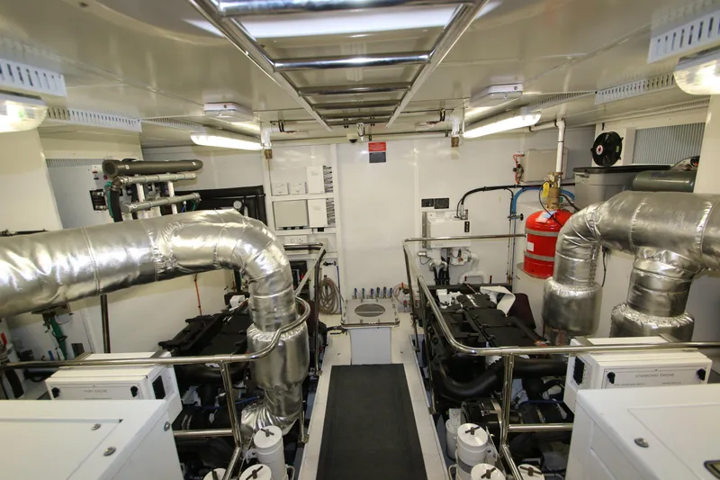 Quit Sun Yacht Photos Pics Engine room of 2015 Hargrave 76 yacht with insulated pipes and machinery.