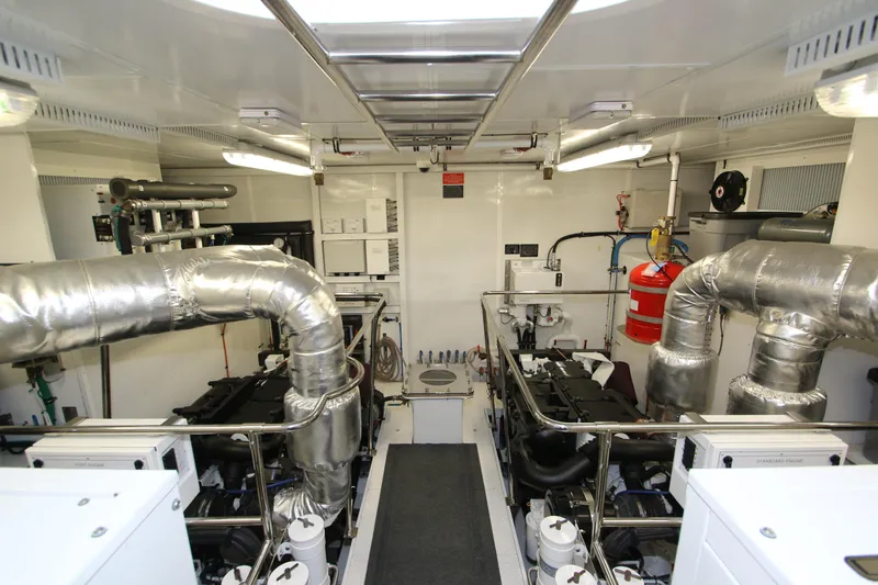 Quit Sun Yacht Photos Pics Engine room of 2015 Hargrave 76 yacht with modern equipment and piping.