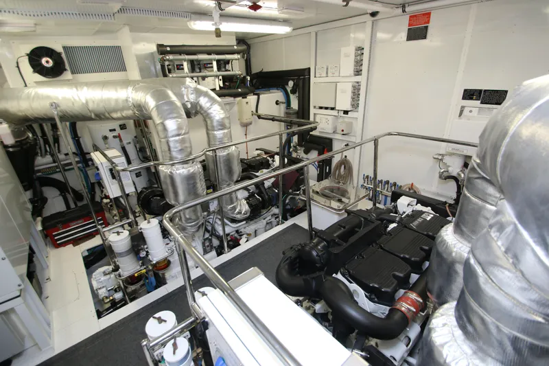 Quit Sun Yacht Photos Pics Engine room of 2015 Hargrave 76 yacht, featuring advanced machinery and piping systems.