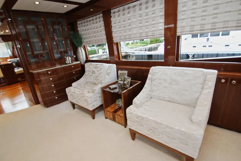 Quit Sun Yacht Photos Pics Luxurious interior of 2015 Hargrave 76 yacht with elegant seating and wooden cabinetry.
