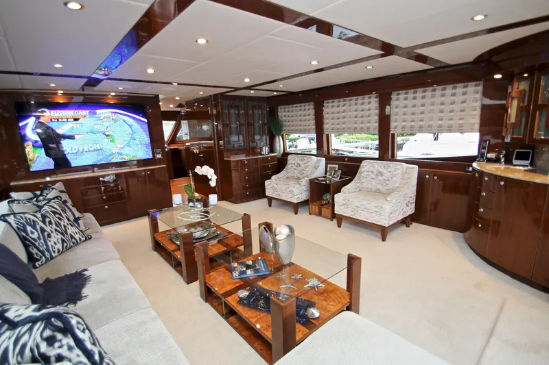 Quit Sun Yacht Photos Pics Luxurious interior of 2015 Hargrave 76 yacht with elegant furnishings and large windows.
