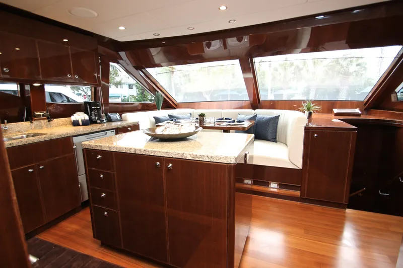 Quit Sun Yacht Photos Pics Luxurious interior of 2015 Hargrave 76 yacht with elegant wood finishes and modern amenities.