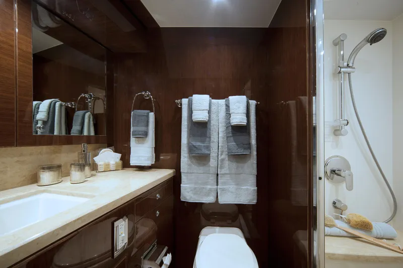 Quit Sun Yacht Photos Pics Luxurious bathroom in 2015 Hargrave 76 yacht with elegant fixtures and plush towels.