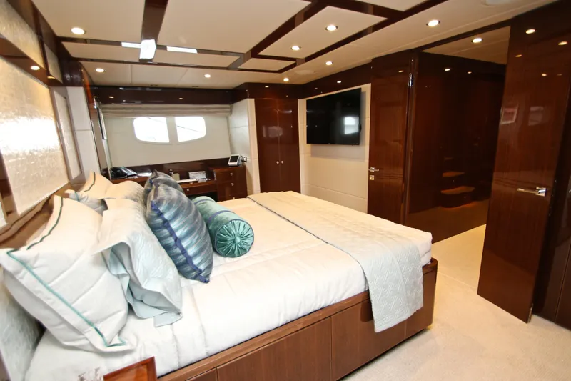 Quit Sun Yacht Photos Pics Luxurious bedroom interior of 2015 Hargrave 76 yacht with elegant wood finishes.
