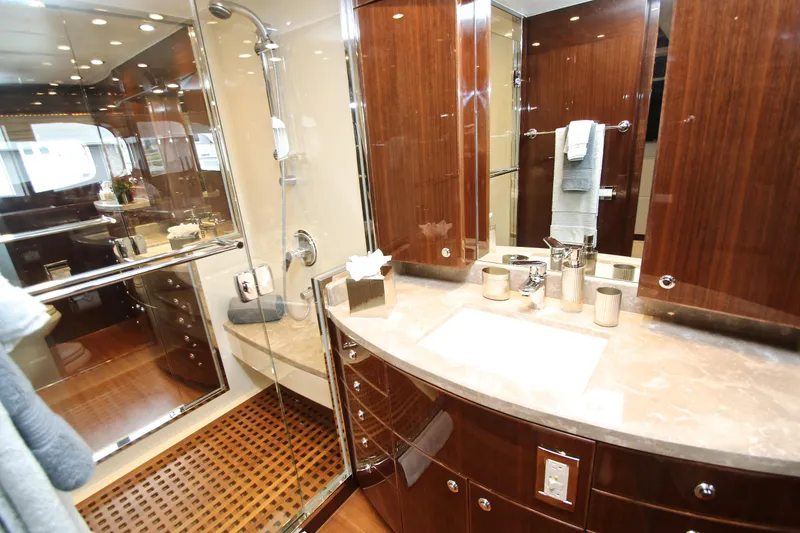Quit Sun Yacht Photos Pics Luxurious bathroom in 2015 Hargrave 76 yacht with elegant wood finishes and modern fixtures.