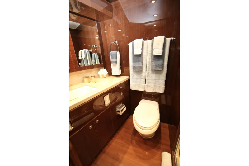 Quit Sun Yacht Photos Pics Luxurious bathroom in 2015 Hargrave 76 yacht with elegant wood finishes and modern amenities.