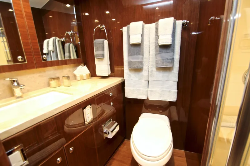 Quit Sun Yacht Photos Pics Luxurious bathroom in 2015 Hargrave 76 yacht with elegant wood finishes and modern amenities.