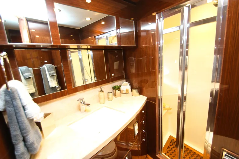 Quit Sun Yacht Photos Pics Luxurious bathroom in 2015 Hargrave 76 yacht with elegant wood finishes and modern fixtures.