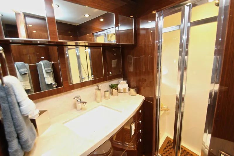 Quit Sun Yacht Photos Pics Luxurious bathroom in 2015 Hargrave 76 yacht with elegant wood finishes and modern fixtures.