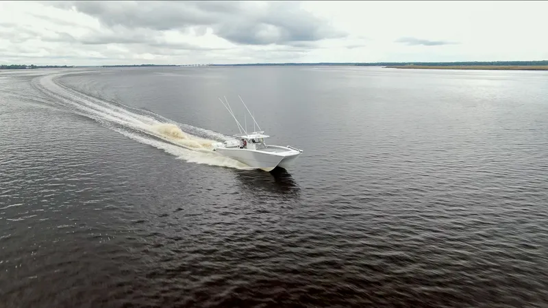  Yacht Photos Pics Freeman 42LR boat cruising on open water under cloudy skies, 2020 model.