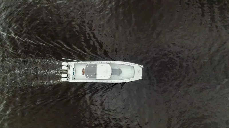 Yacht Photos Pics Aerial view of 2020 Freeman 42LR boat cruising on dark water.