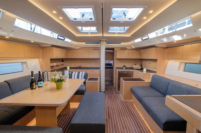  Yacht Photos Pics Luxurious interior of 2022 Bavaria C57 yacht with modern furnishings and skylights.