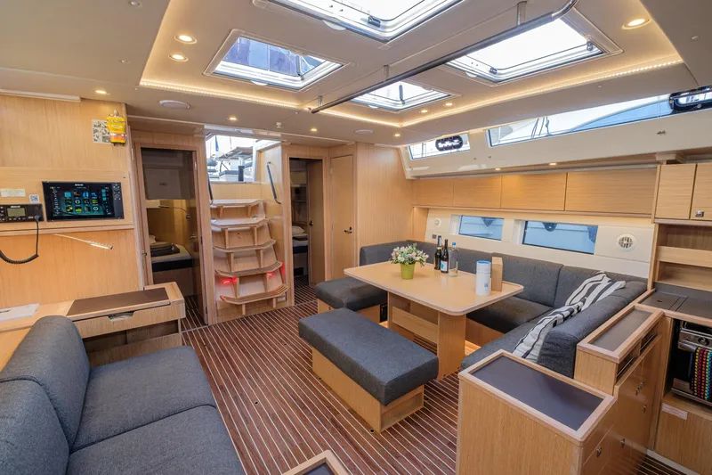  Yacht Photos Pics Luxurious interior of 2022 Bavaria C57 yacht with modern furnishings and ample natural light.