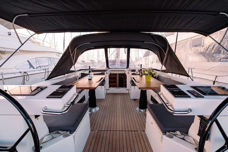  Yacht Photos Pics Luxurious 2022 Bavaria C57 yacht interior with elegant seating and dining area.