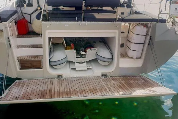  Yacht Photos Pics 2022 Bavaria C57 yacht with open swim platform and storage compartment.