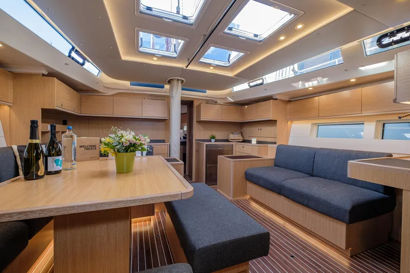  Yacht Photos Pics Luxurious interior of 2022 Bavaria C57 yacht with modern furnishings and skylights.
