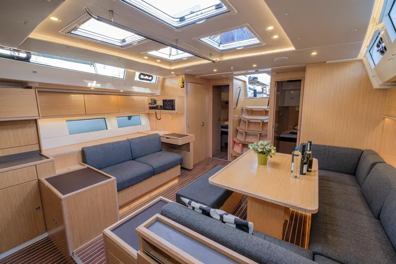  Yacht Photos Pics Luxurious interior of 2022 Bavaria C57 yacht with modern furnishings and skylights.