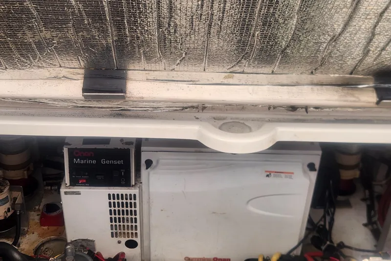 Bella Vita Yacht Photos Pics Engine compartment of 2002 Cruisers Yachts 3870 Express with Onan Marine Genset.