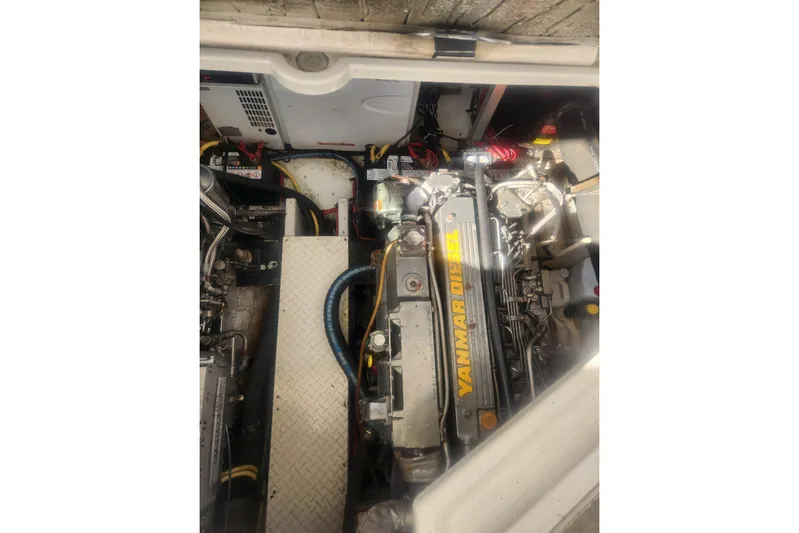Bella Vita Yacht Photos Pics Engine compartment of 2002 Cruisers Yachts 3870 Express with Yanmar diesel engine.