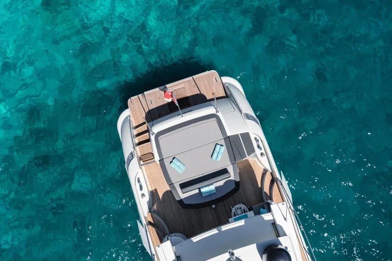  Yacht Photos Pics Aerial view of 2007 Azimut 68S yacht on clear blue water.