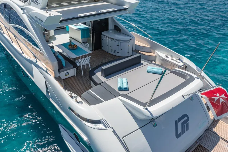  Yacht Photos Pics Luxurious 2007 Azimut 68S yacht with spacious deck and elegant seating on clear blue water.