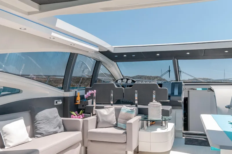  Yacht Photos Pics Luxurious interior of a 2007 Azimut 68S yacht with modern seating and panoramic windows.