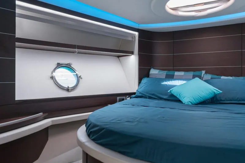  Yacht Photos Pics Luxurious bedroom interior of 2007 Azimut 68S yacht with modern design and porthole view.