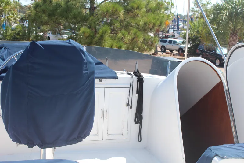 Gods Favor Yacht Photos Pics 1986 DeFever 53 yacht deck with covered helm and storage cabinets.