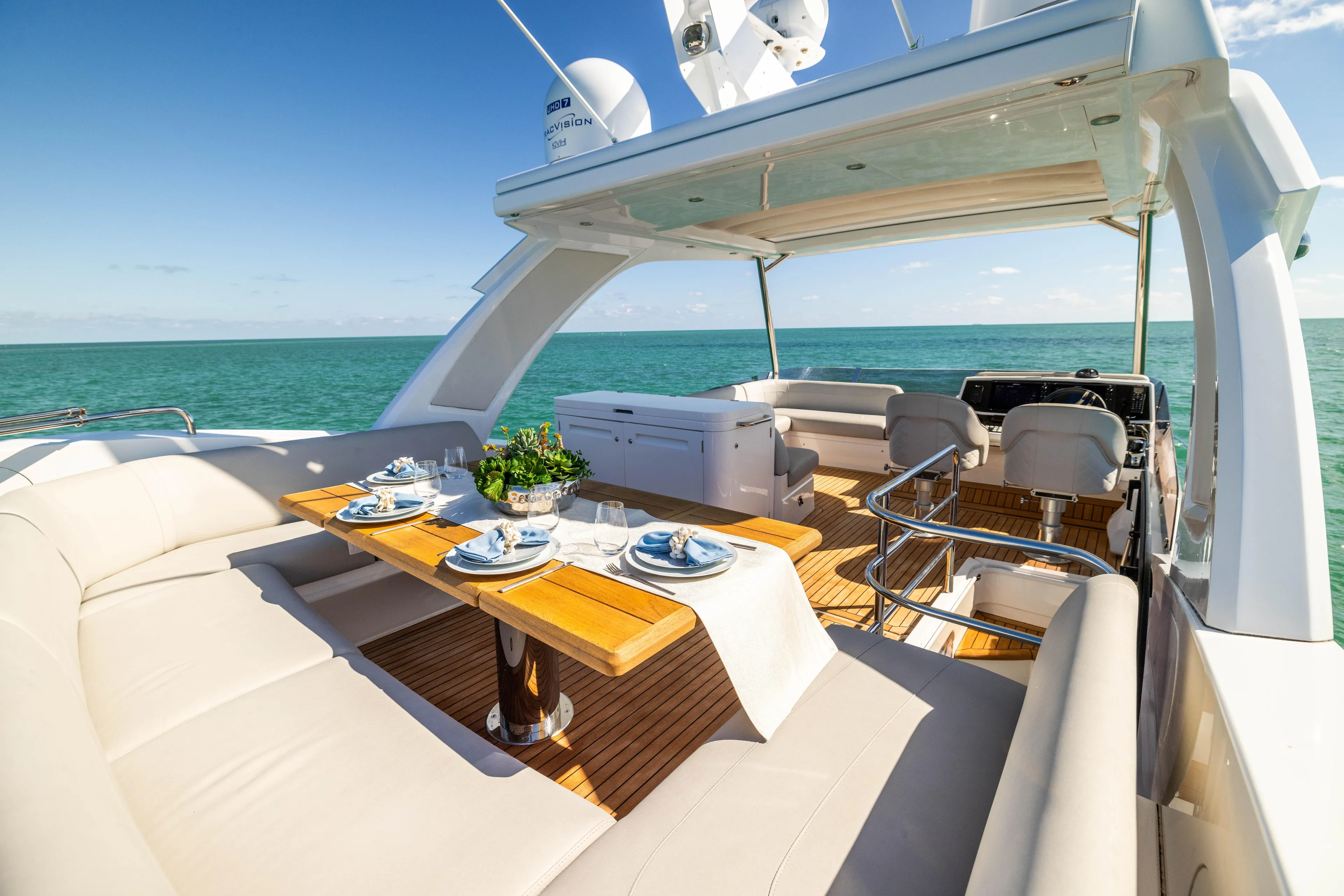 Dreams Yacht Photos Pics Luxurious Sunseeker Manhattan 55 yacht deck with elegant dining setup, 2021 model.